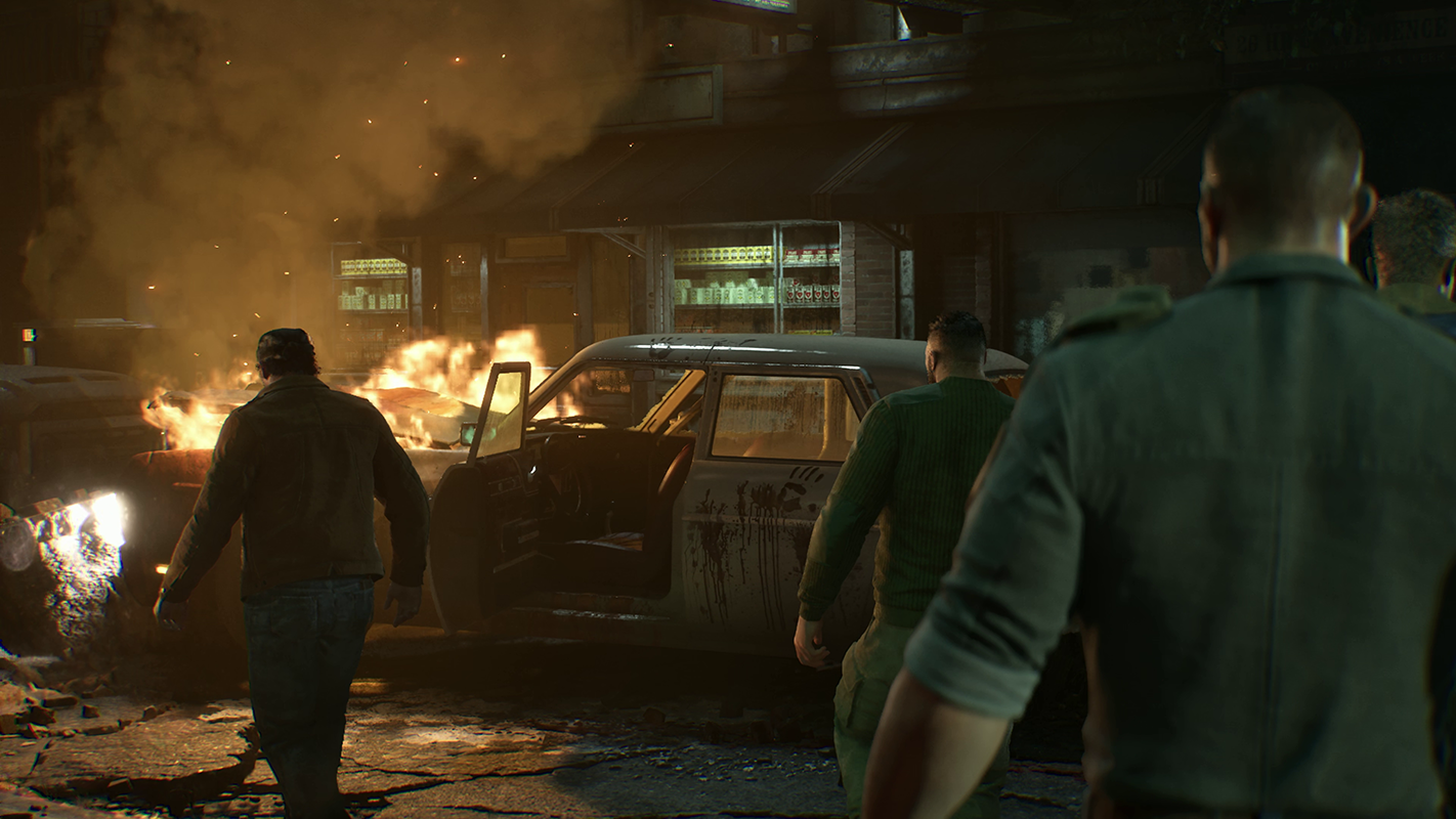 Marcus, Dom and the others inspect the wreckage of a vehicle.